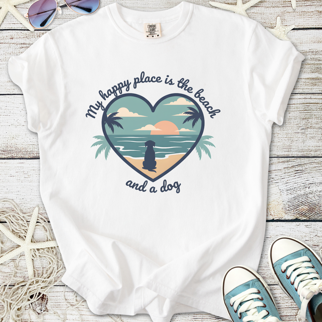 White graphic t-shirt with beach design and dog silhouette, featuring "My happy place is the beach and a dog" text.