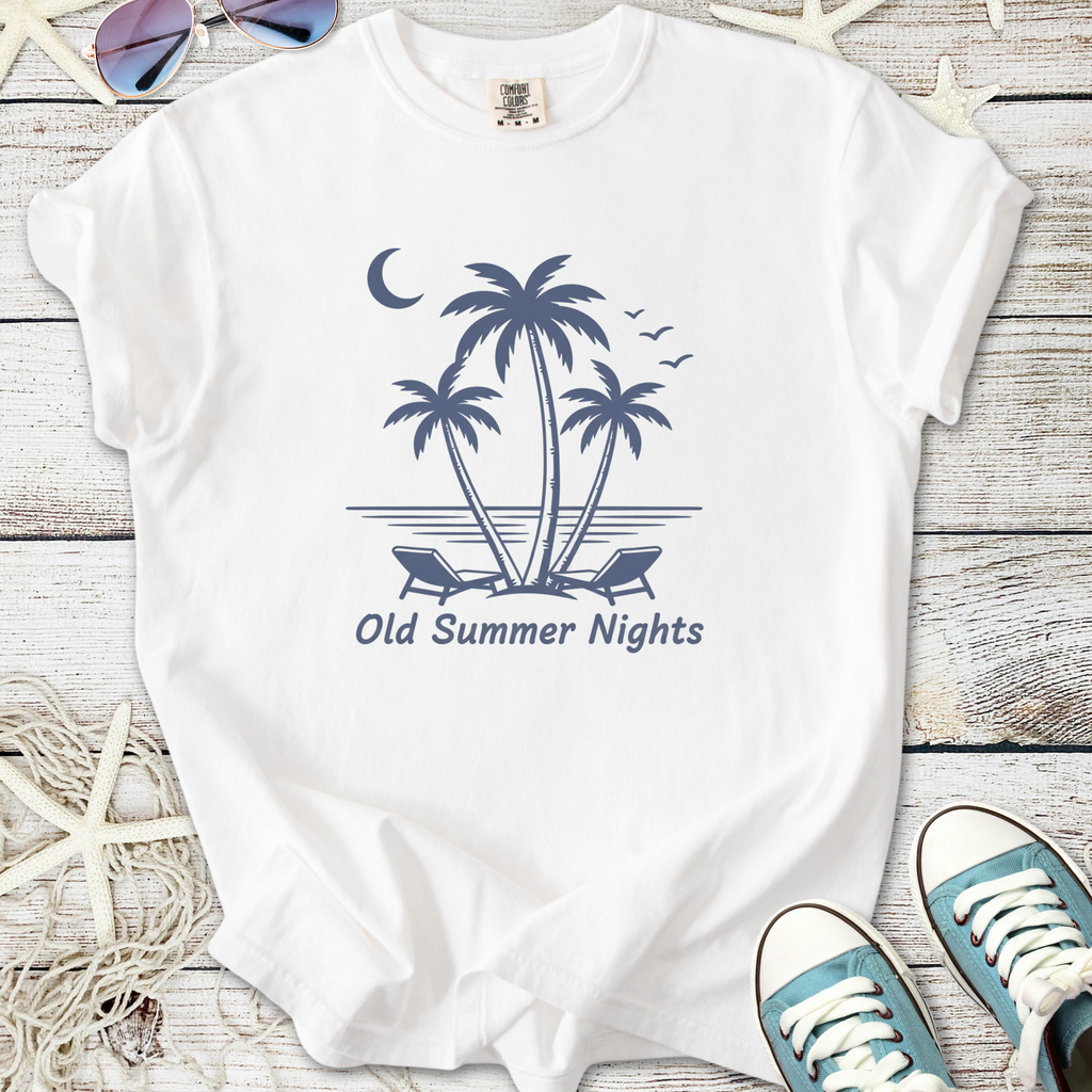 White t-shirt with 'Old Summer Nights' print featuring palm trees and beach chairs, perfect for summer outings.