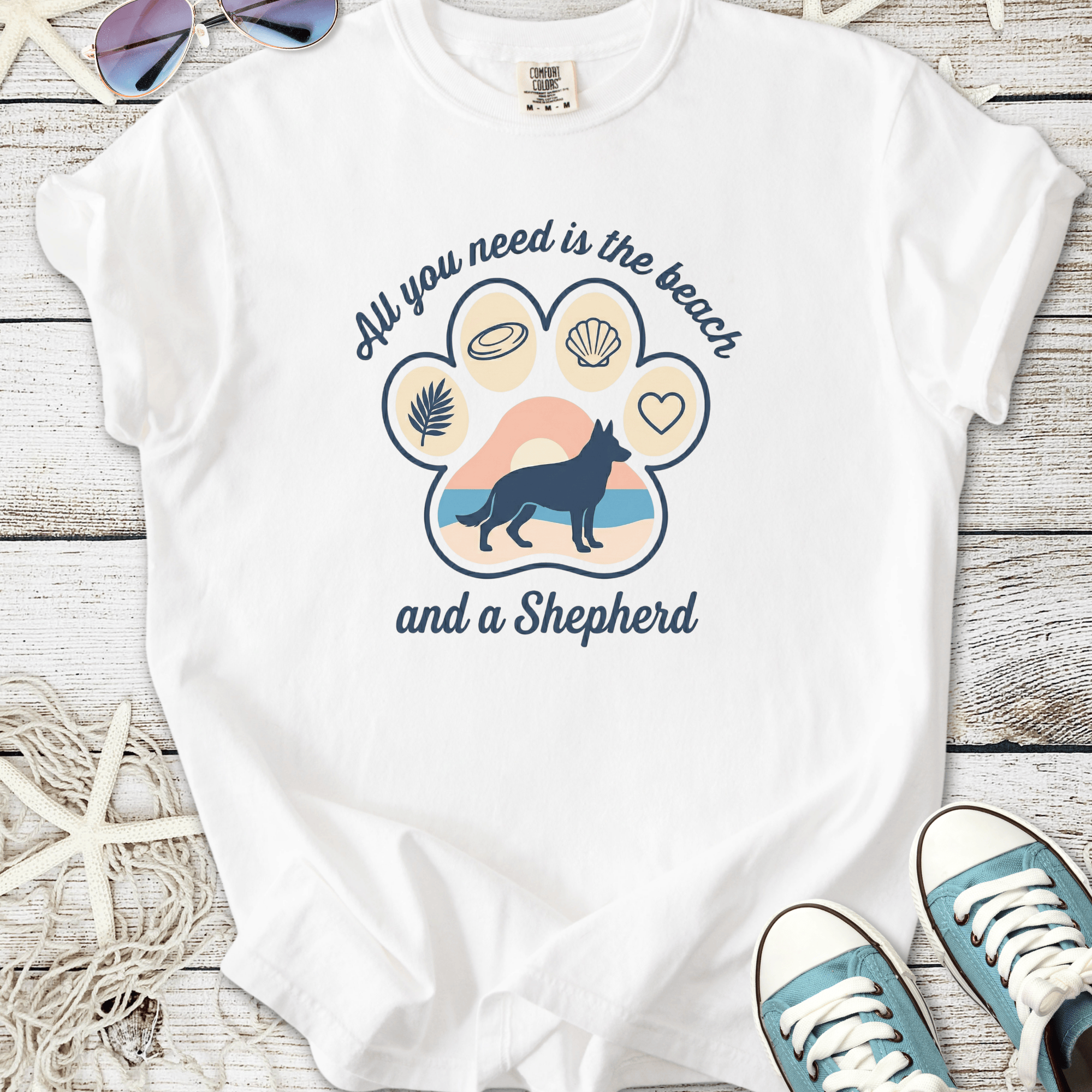 White T-shirt with beach-themed graphic and German Shepherd design, perfect for dog lovers.