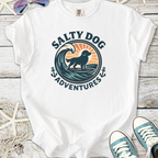 White t-shirt featuring 'Salty Dog Adventures' graphic with a dog and wave design.