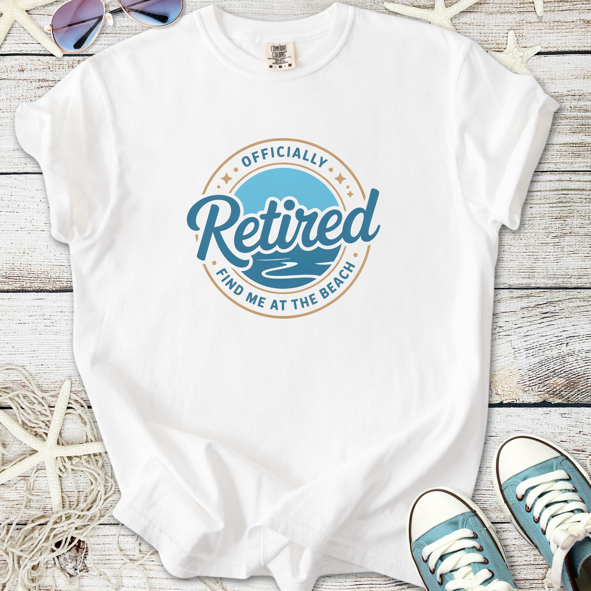 White cotton t-shirt with 'Officially Retired' beach graphic, perfect for relaxed retirement wear.