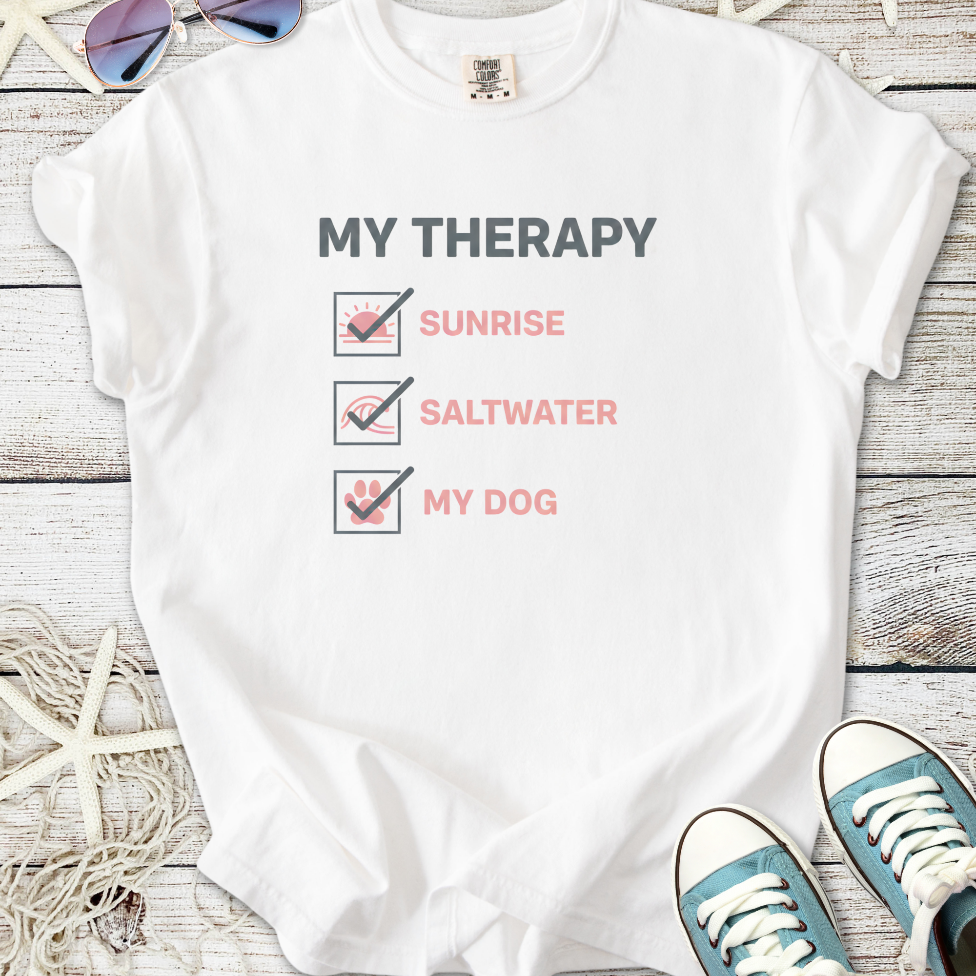 White t-shirt with 'My Therapy' graphic, featuring checks for sunrise, saltwater, and dog.