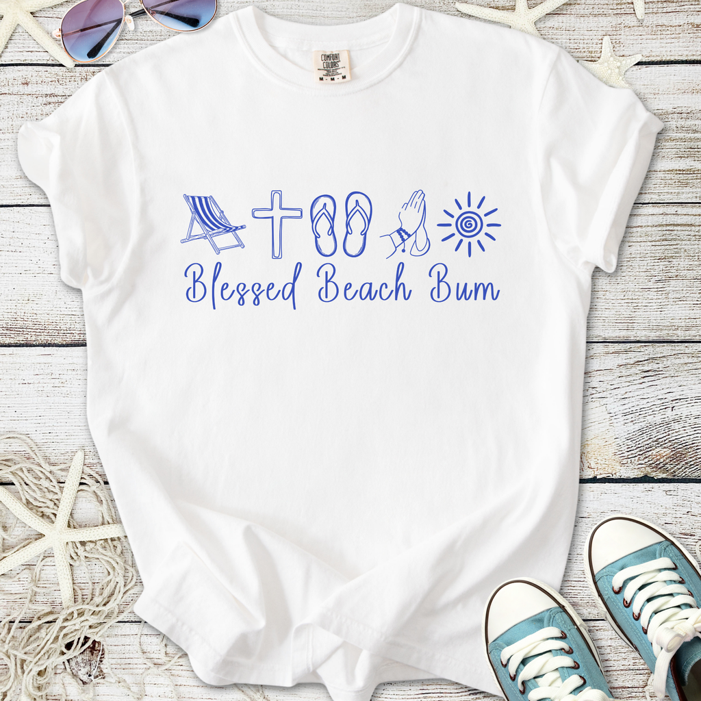 White t-shirt featuring 'Blessed Beach Bum' design with beach icons in blue. Perfect for summer wear.