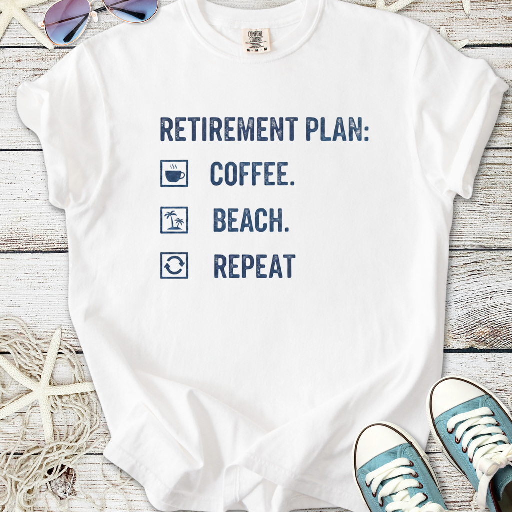 White cotton t-shirt with 'Retirement Plan: Coffee, Beach, Repeat' print, perfect for casual wear.