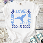 White t-shirt with blue beach-themed design, featuring 'Peace Love Beach' and a whale tail graphic.