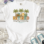 White t-shirt with 'Retired' graphic, palm trees, and sunset; perfect for relaxed, casual vibes.