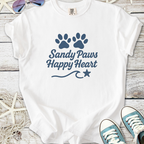 White t-shirt with 'Sandy Paws Happy Heart' design and paw prints, perfect for beach lovers.