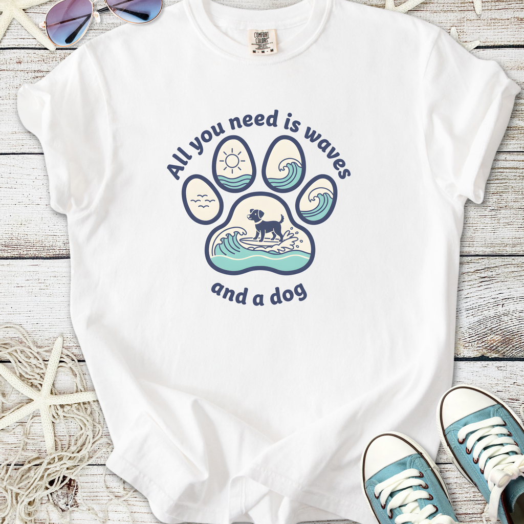 White t-shirt with a dog and wave graphic, featuring 'All you need is waves and a dog' slogan.
