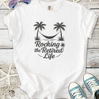 White t-shirt with 'Rocking the Retired Life' design, featuring palm trees and a hammock.