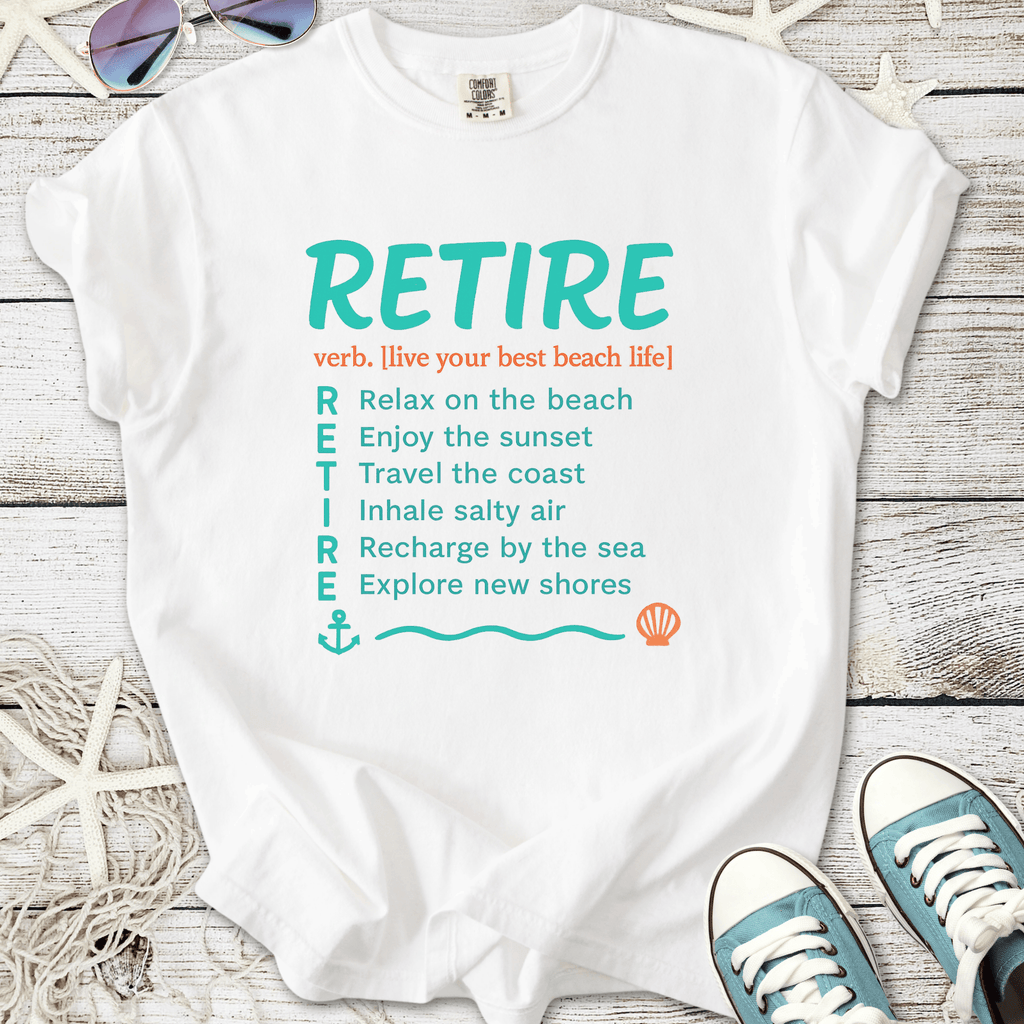 White t-shirt with 'RETIRE' text and beach life definitions, perfect for coastal relaxation.
