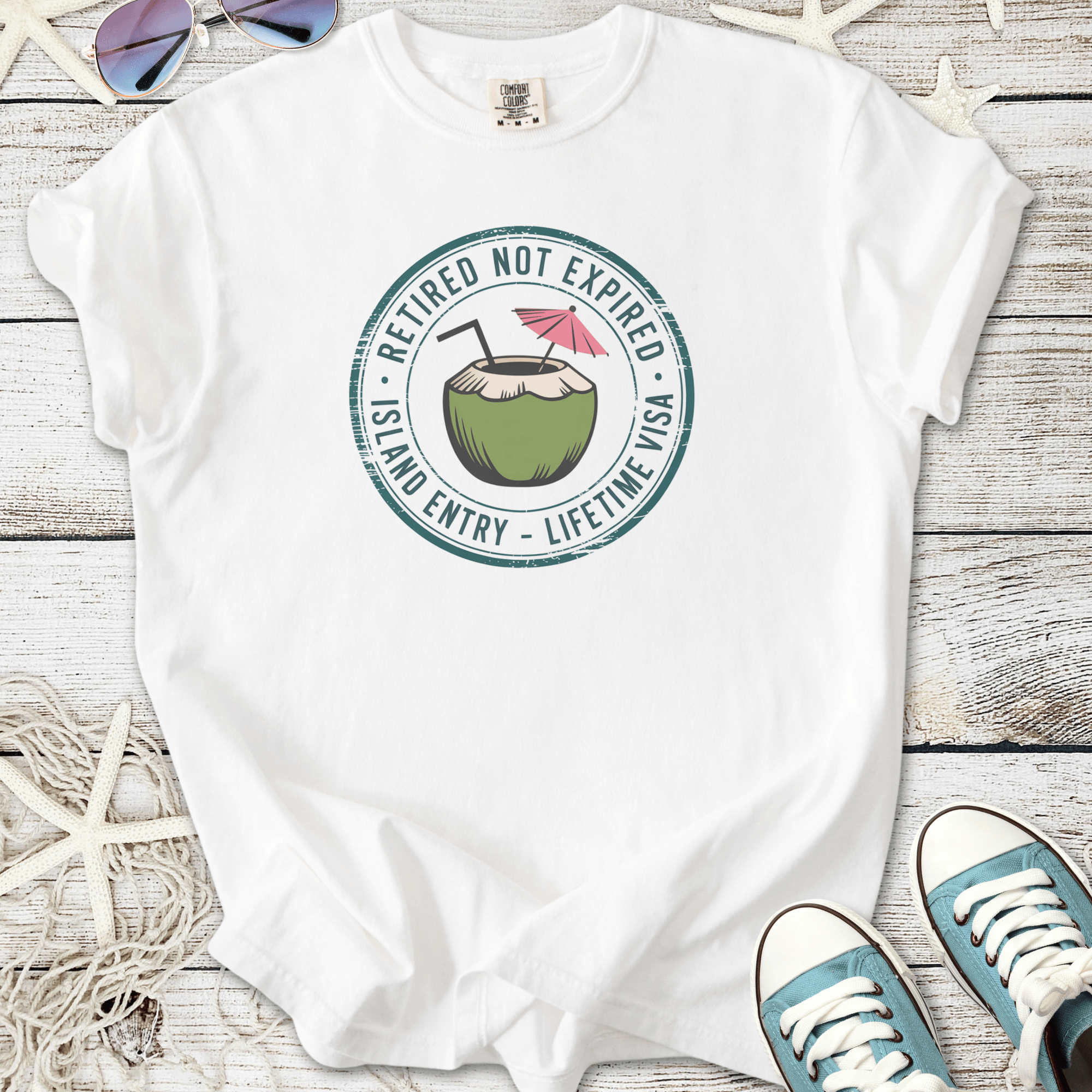 White cotton t-shirt with a fun coconut drink graphic and 'Retired Not Expired' slogan.
