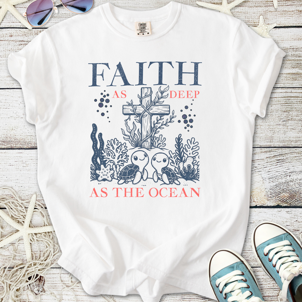 White t-shirt with ocean-themed design featuring turtles and cross, promoting faith and hope.