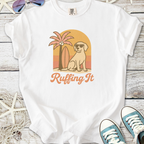 White t-shirt with 'Ruffing It' graphic, featuring a dog, palm tree, and surfboard design.