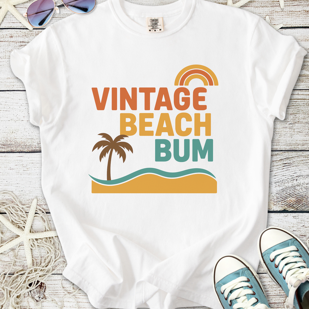 Vintage Beach Bum white t-shirt with colorful palm tree and wave graphic, ideal for summer wear.
