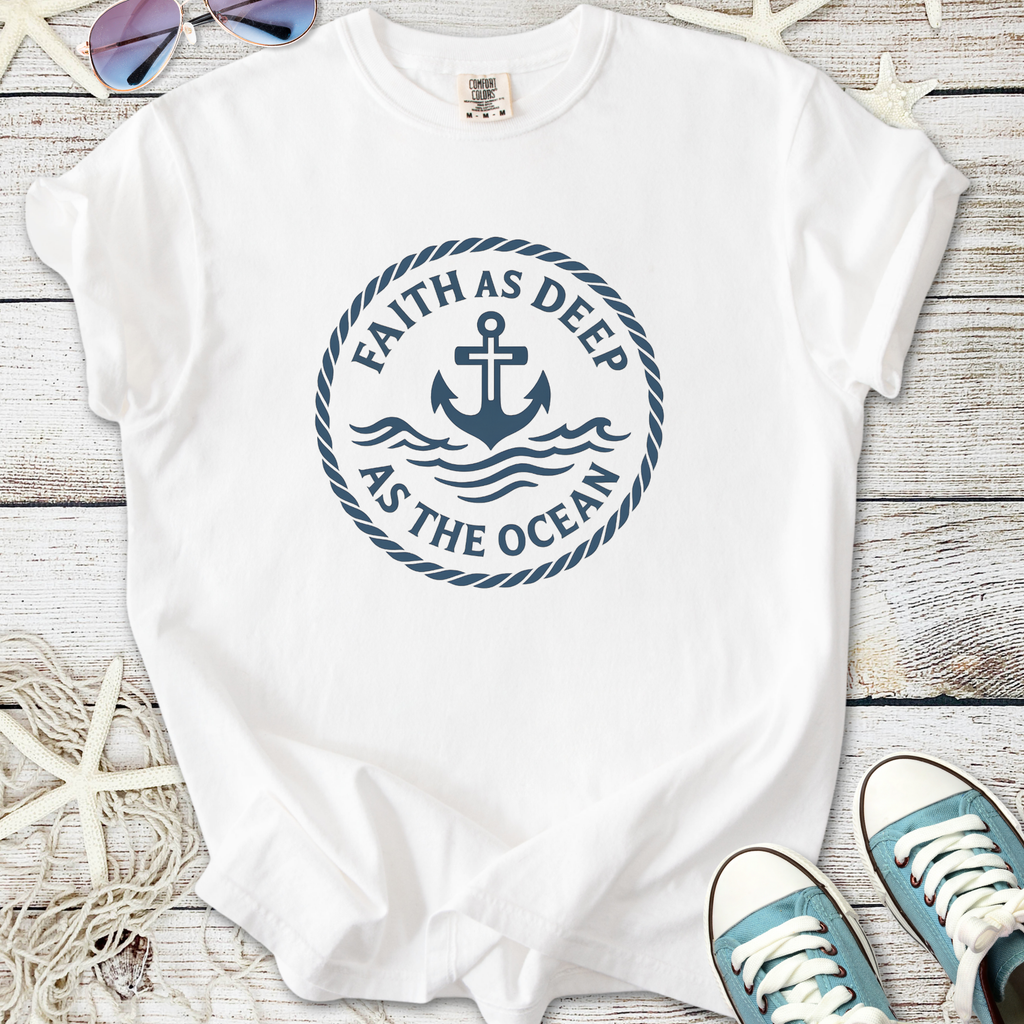 White cotton t-shirt featuring navy blue nautical anchor graphic with 'Faith as Deep as the Ocean' text.