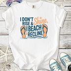 White graphic tee with beach theme, featuring 'I Beach & Recline' text and flip-flops design.