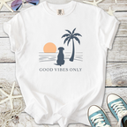 White t-shirt with 'Good Vibes Only' graphic featuring a dog and palm tree at sunset.