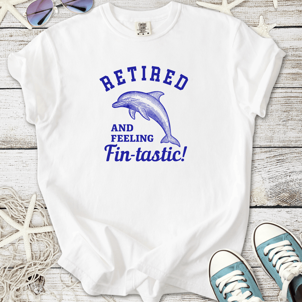 White t-shirt with blue dolphin graphic and 'Retired and Feeling Fin-tastic!' slogan.