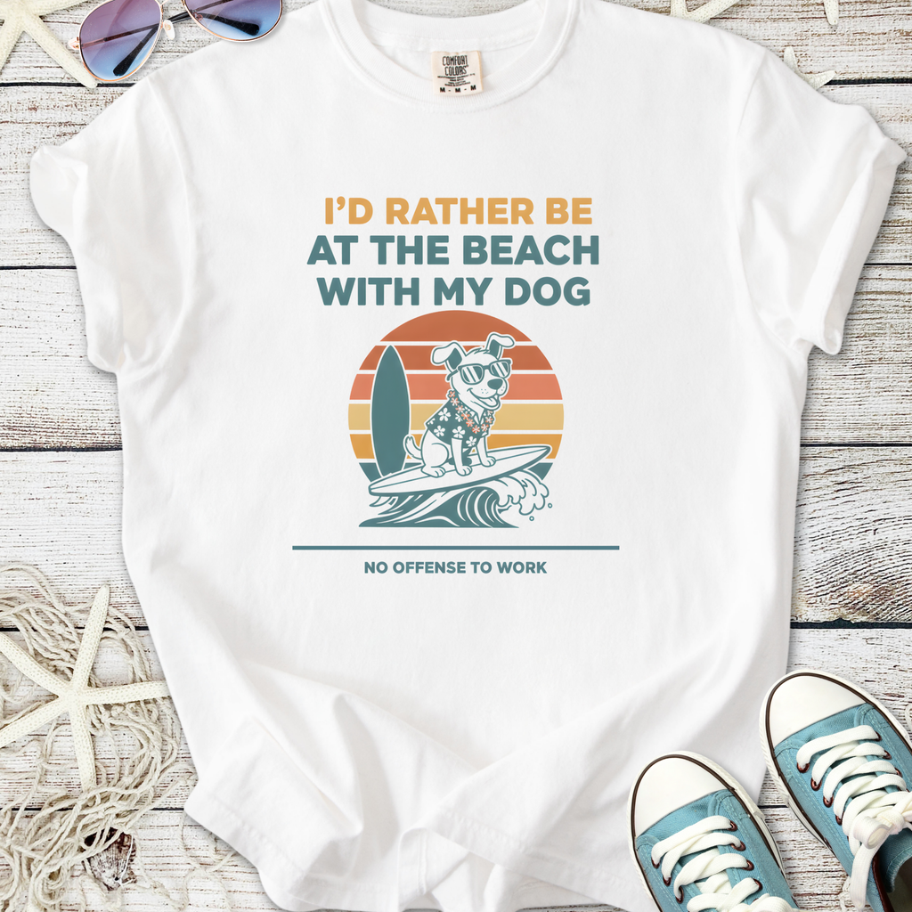 White t-shirt featuring playful dog graphic, surfboard design, and beach-themed text for dog lovers.