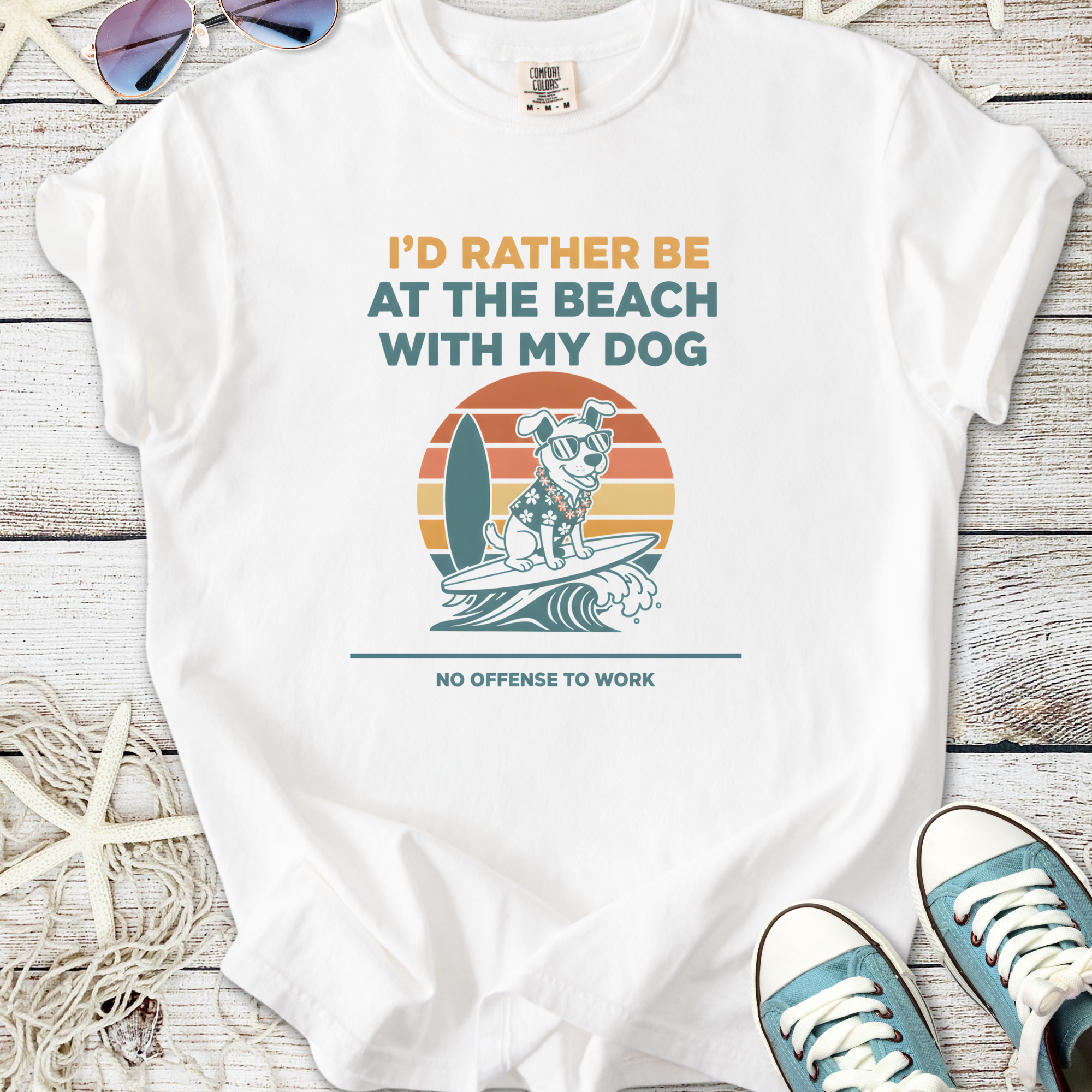 White t-shirt featuring playful dog graphic, surfboard design, and beach-themed text for dog lovers.