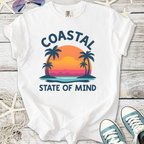 White t-shirt with 'Coastal State of Mind' graphic, featuring palm trees and sunset design.