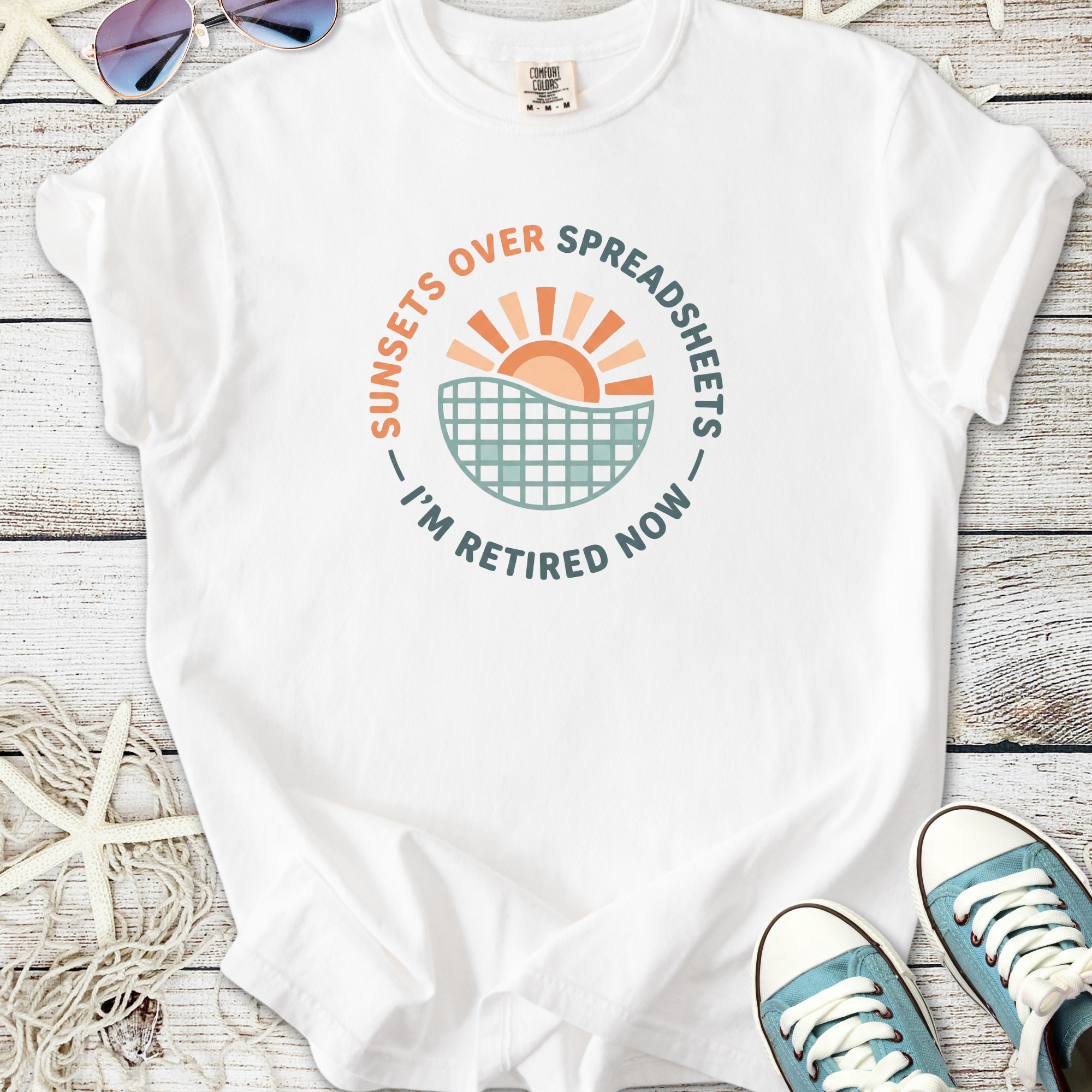 White t-shirt with 'Sunsets Over Spreadsheets I'm Retired Now' graphic design, casual and comfortable.