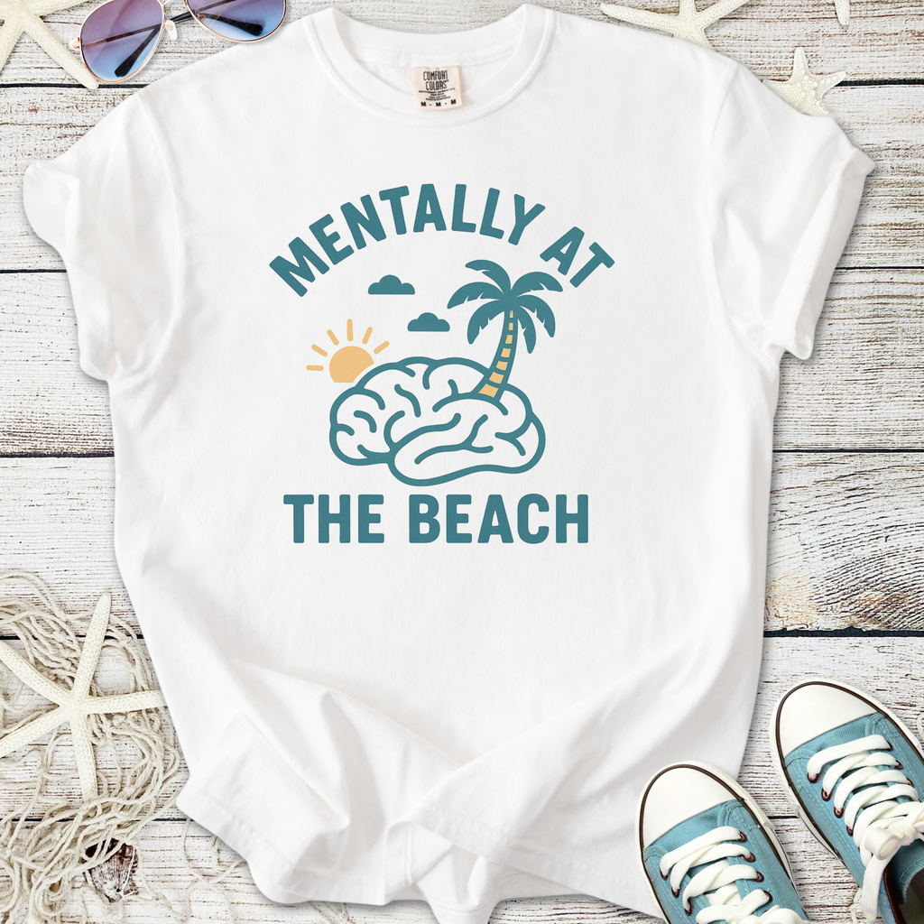 White cotton tee with 'Mentally At The Beach' graphic, featuring palm tree and sun design.