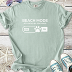 Mint green t-shirt featuring 'Beach Mode Activated by Dog Walk' graphic, perfect for dog lovers.