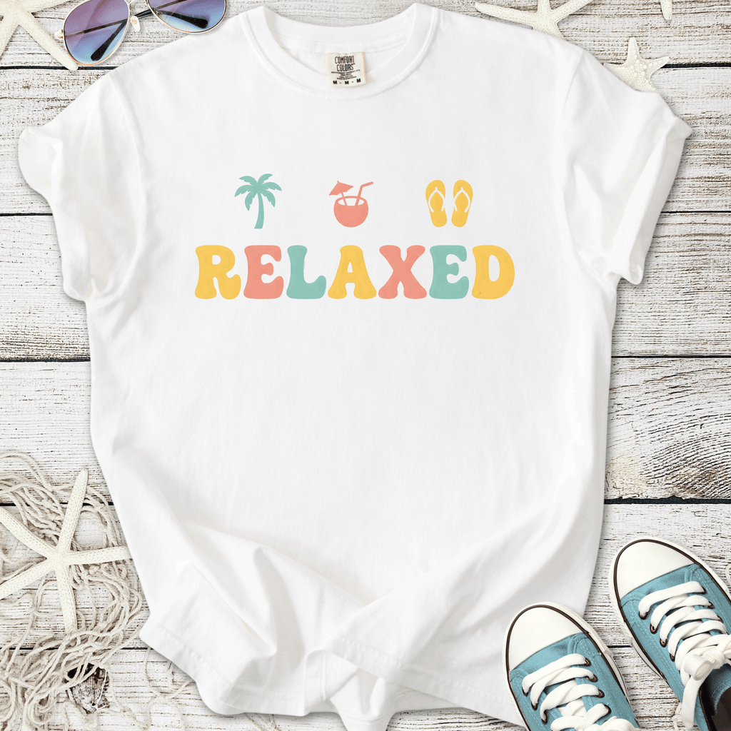 White relaxed graphic t-shirt with vibrant colors and tropical theme, perfect for casual summer wear.