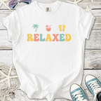 White relaxed graphic t-shirt with vibrant colors and tropical theme, perfect for casual summer wear.