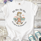 White graphic tee featuring a retro beach design with a child and the phrase 'It's Off to the Beach I Go'.