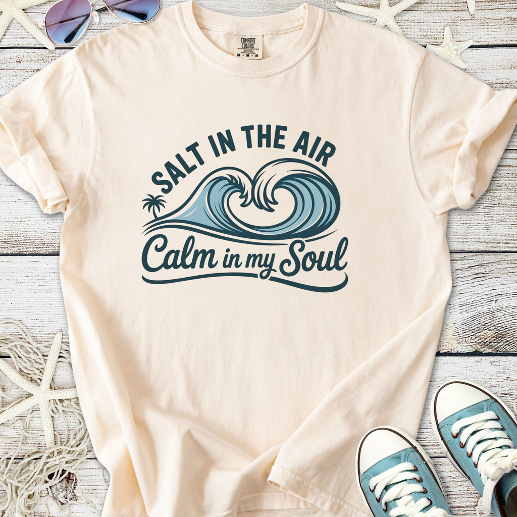 Light peach t-shirt with ocean waves graphic reading 'Salt in the Air, Calm in my Soul'