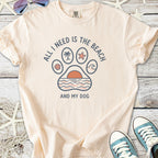 Light peach graphic tee featuring beach-themed design and text, perfect for dog lovers.