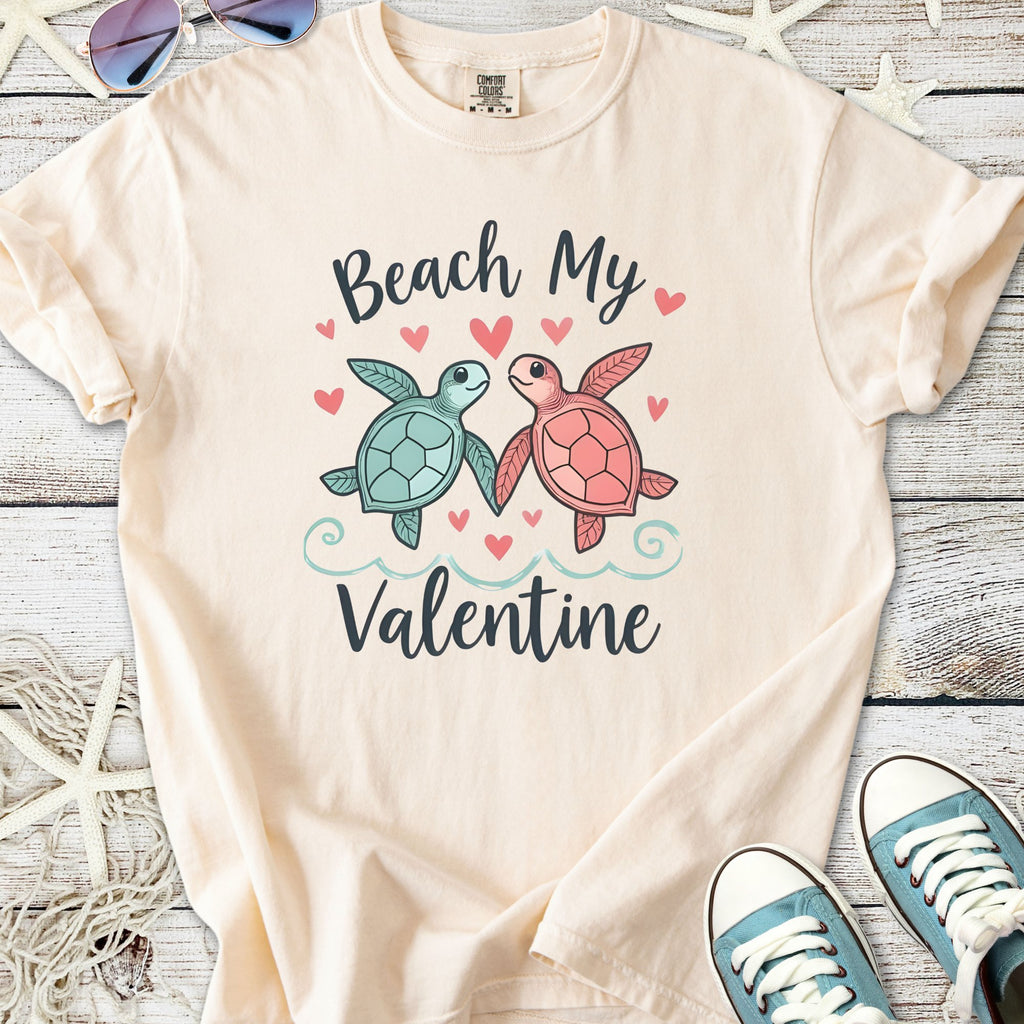 Cream t-shirt with 'Beach My Valentine' design featuring cute turtles and hearts, perfect for Valentine's Day.