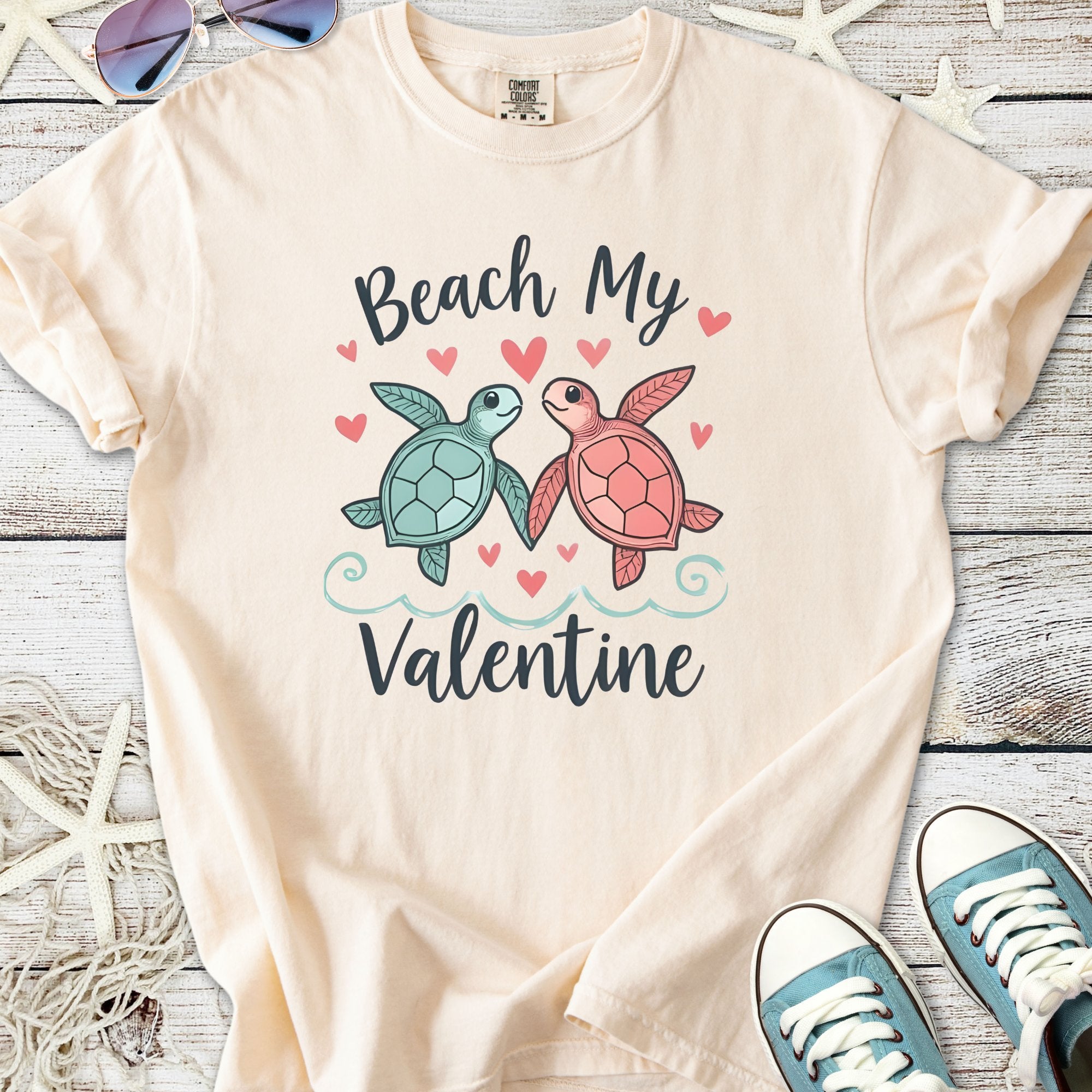 Cream t-shirt with 'Beach My Valentine' design featuring cute turtles and hearts, perfect for Valentine's Day.