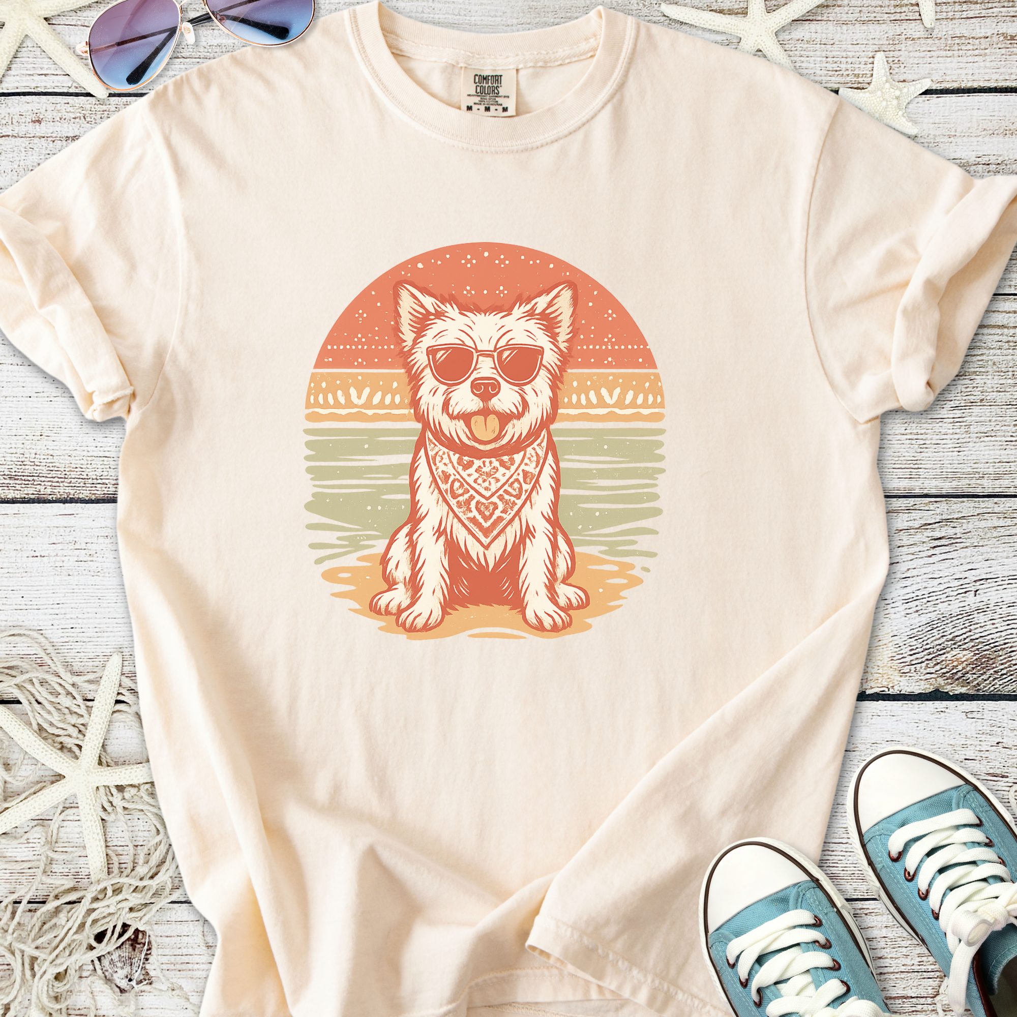 Cream cotton t-shirt featuring a dog in sunglasses and bandana, perfect for casual summer wear.