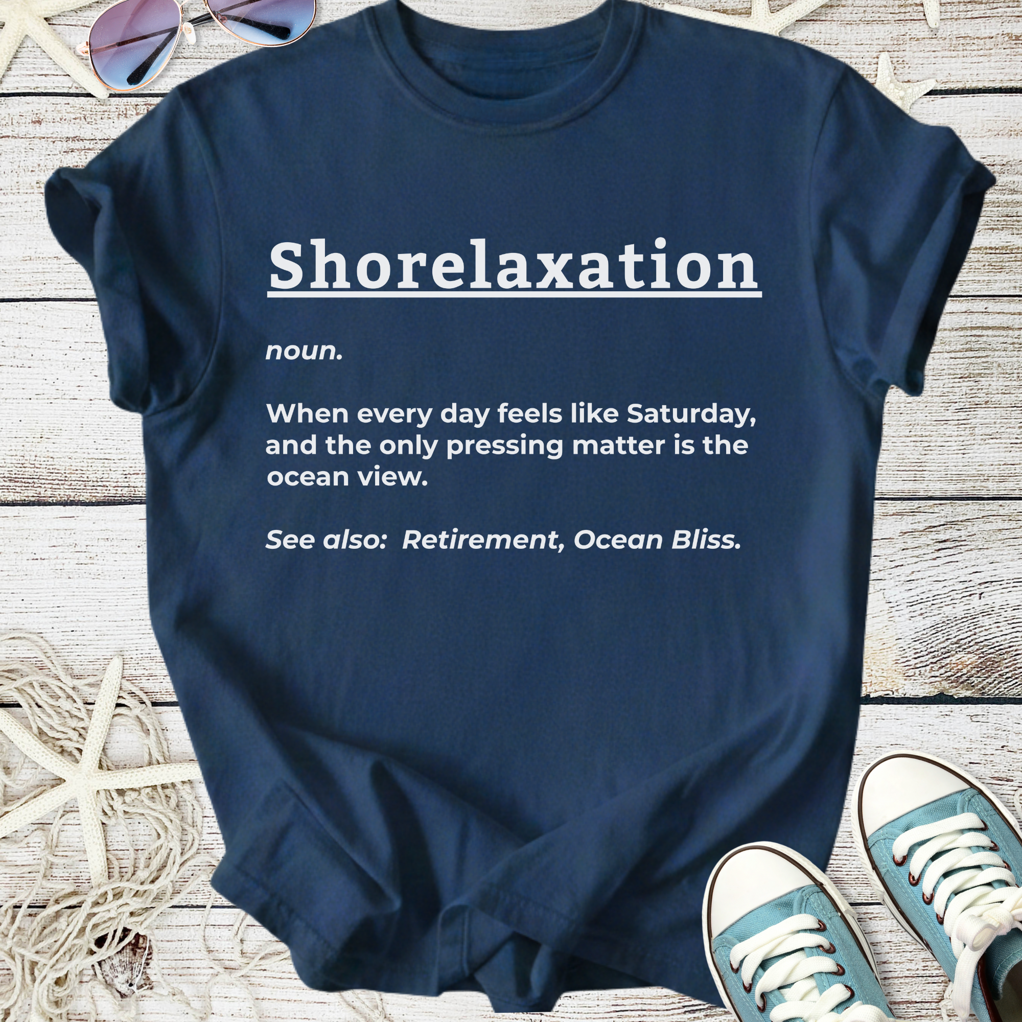 Navy blue t-shirt with 'Shorelaxation' print, perfect for beach lovers and relaxation enthusiasts.