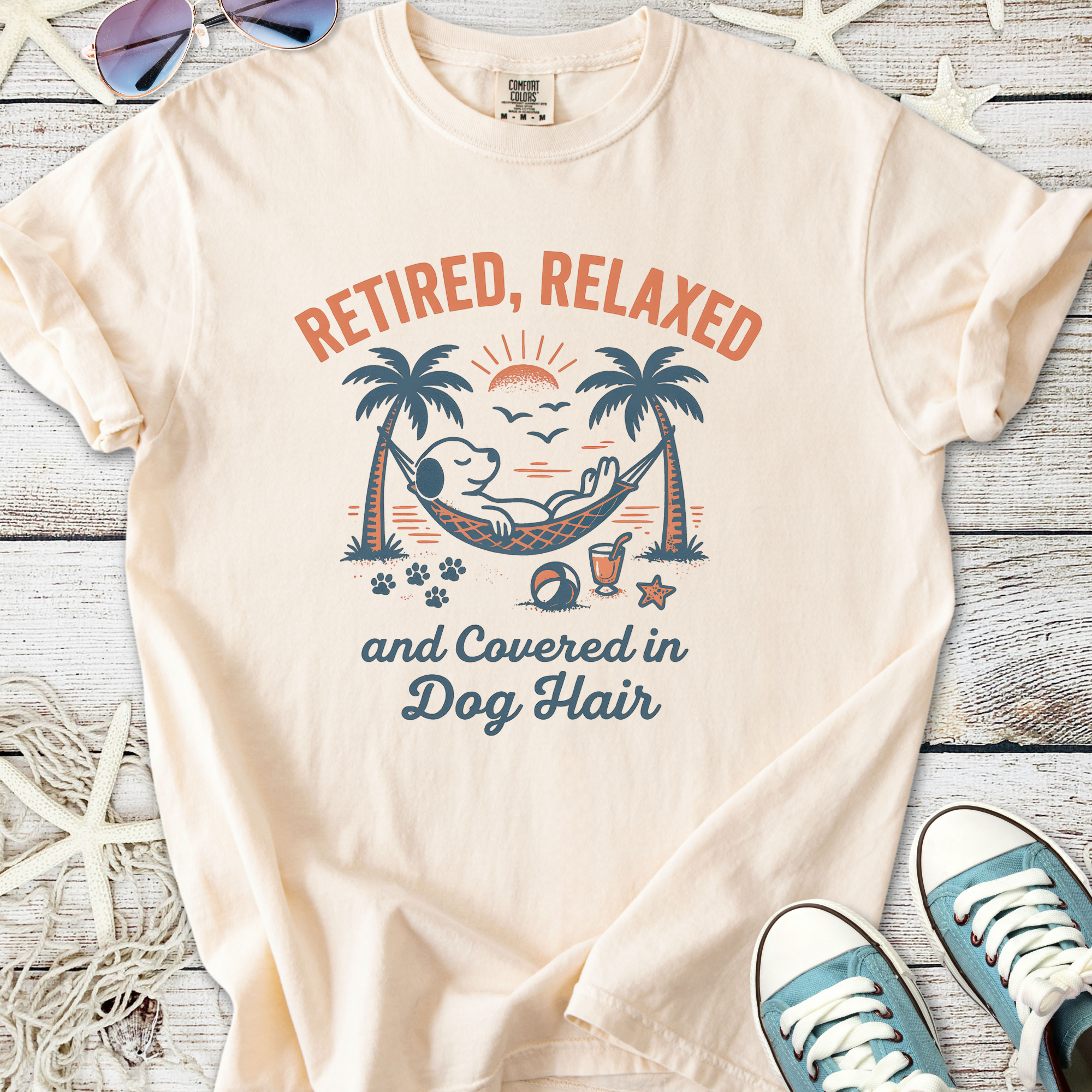Light beige t-shirt with 'Retired, Relaxed, and Covered in Dog Hair' graphic featuring a lounging dog.