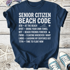 Navy blue t-shirt with 'Senior Citizen Beach Code' graphic and beach-themed phrases, perfect for beach lovers.