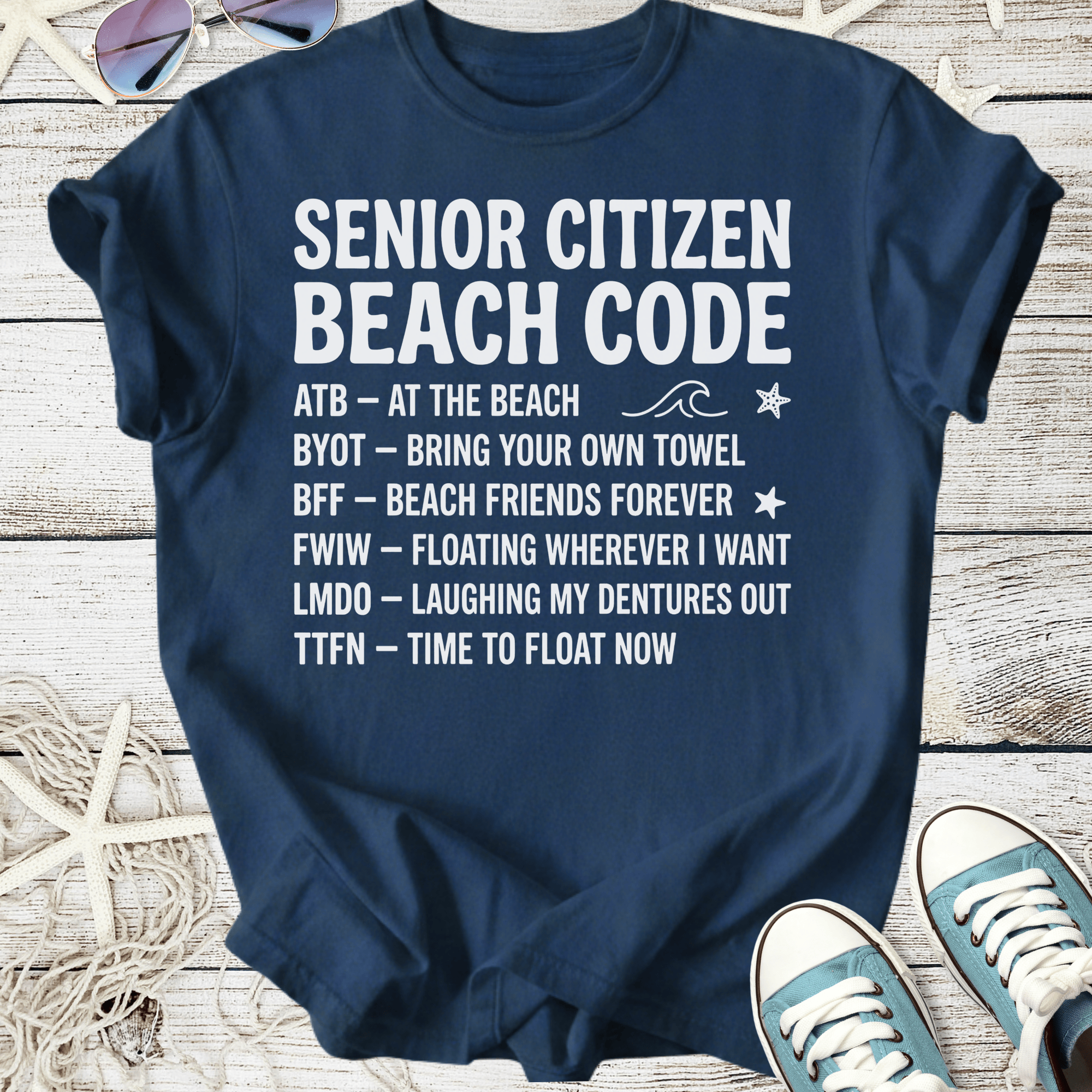 Navy blue t-shirt with 'Senior Citizen Beach Code' graphic and beach-themed phrases, perfect for beach lovers.