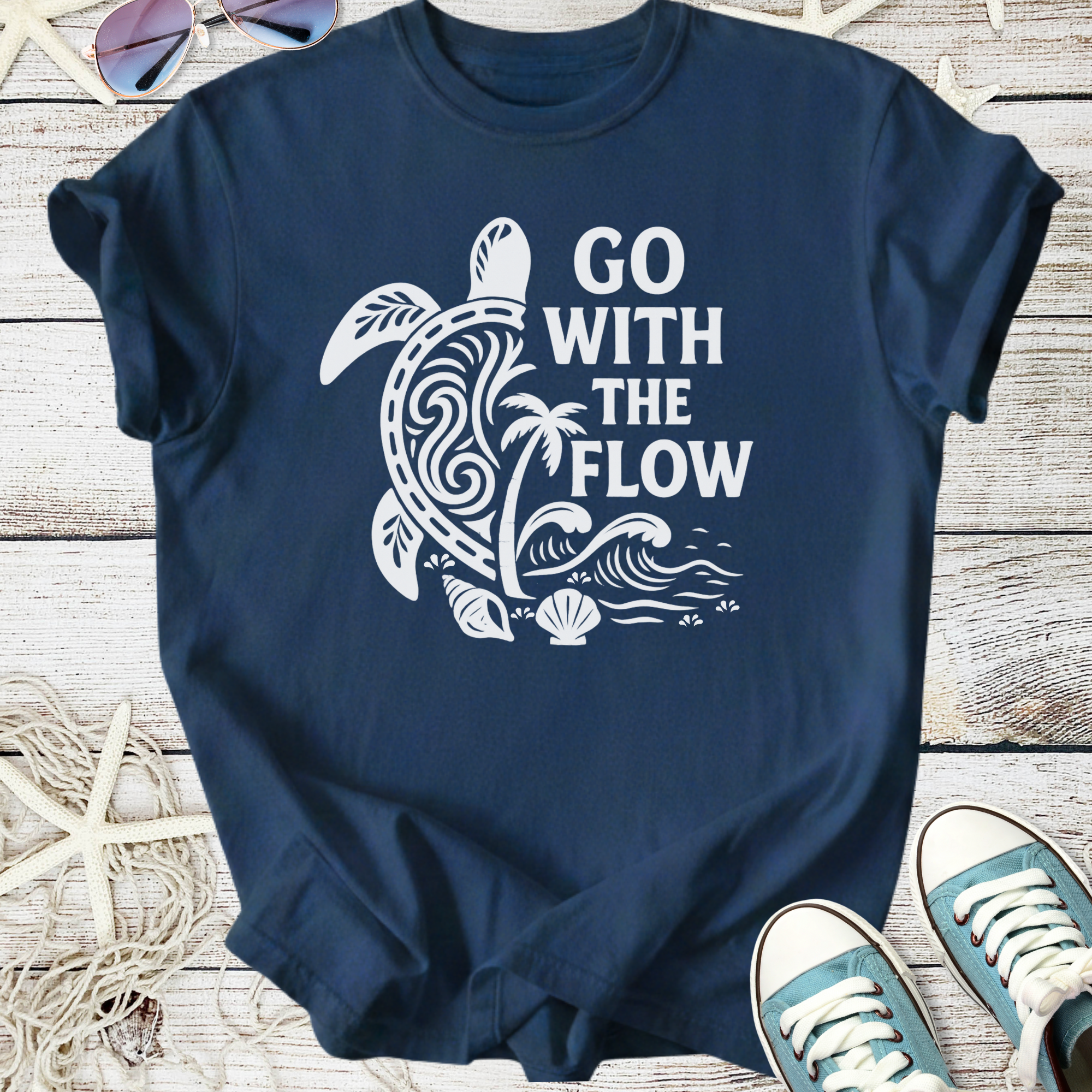 Navy blue t-shirt featuring a turtle graphic and 'Go With The Flow' phrase, perfect for beach lovers.