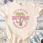 Light beige retired graphic tee with palm trees and flamingo design, perfect for relaxed, tropical vibes.