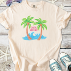 Beige t-shirt featuring colorful palm trees and waves, with 'Coastal Vibes Only' graphic design.