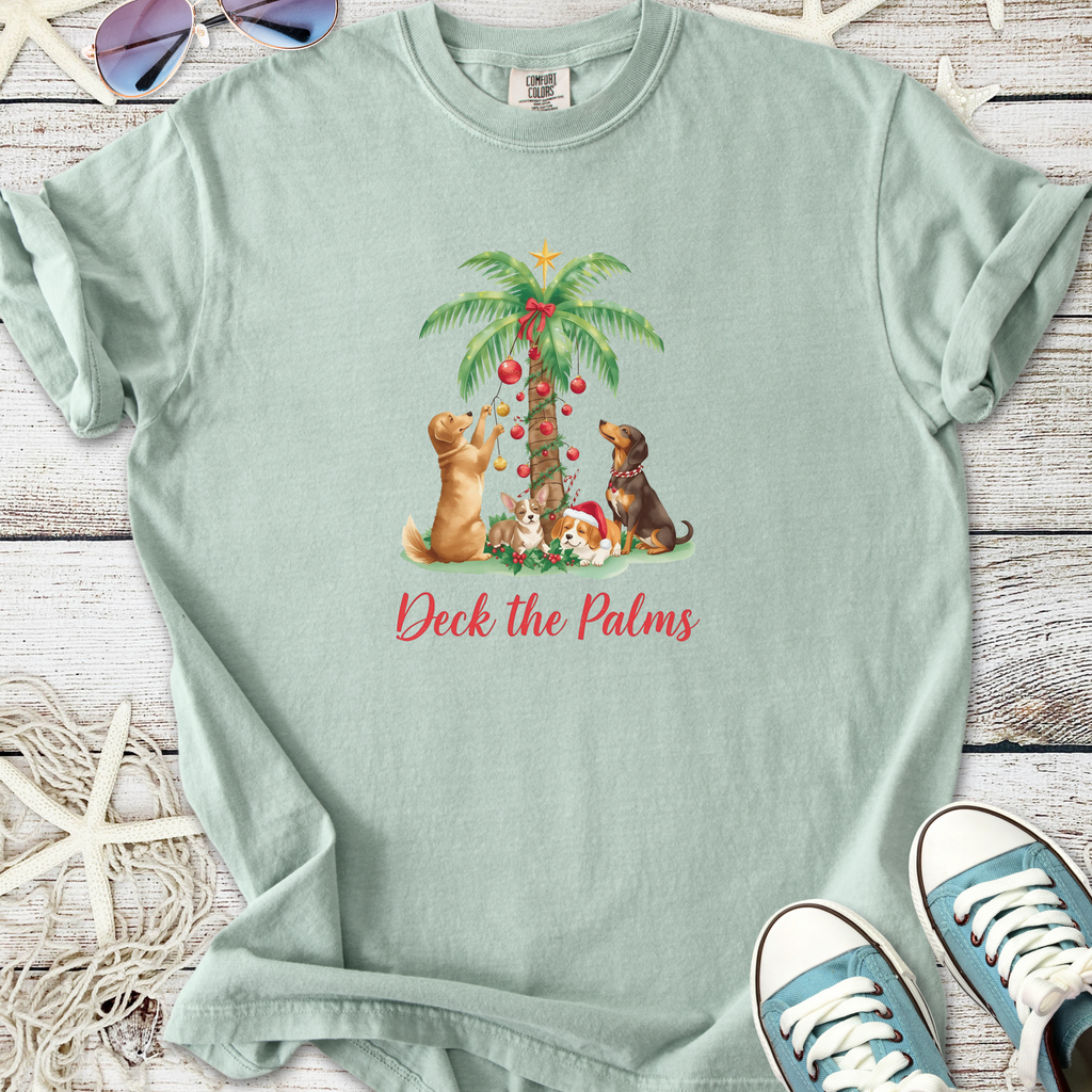 Light teal t-shirt featuring festive pets and palm tree design with 'Deck the Palms' text.