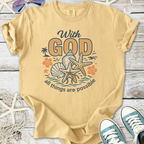 Tan t-shirt with 'With God all things are possible' graphic, seashell and starfish design, casual wear.
