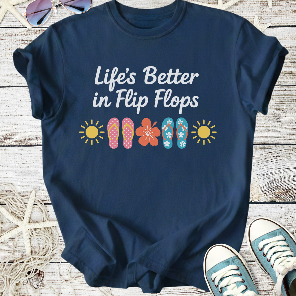 Navy blue graphic tee featuring "Life's Better in Flip Flops" with colorful flip flop designs and sun motifs.