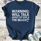 Navy blue t-shirt with fun text: 'Warning: Will Talk About My Dog & The Beach', perfect for pet lovers.
