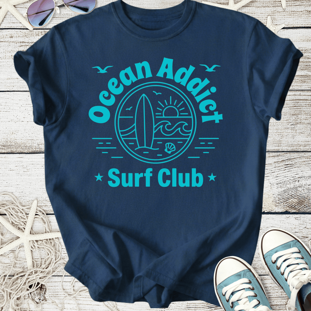 Navy blue graphic tee 'Ocean Addict Surf Club' with surf and sun design, perfect for beach lovers.