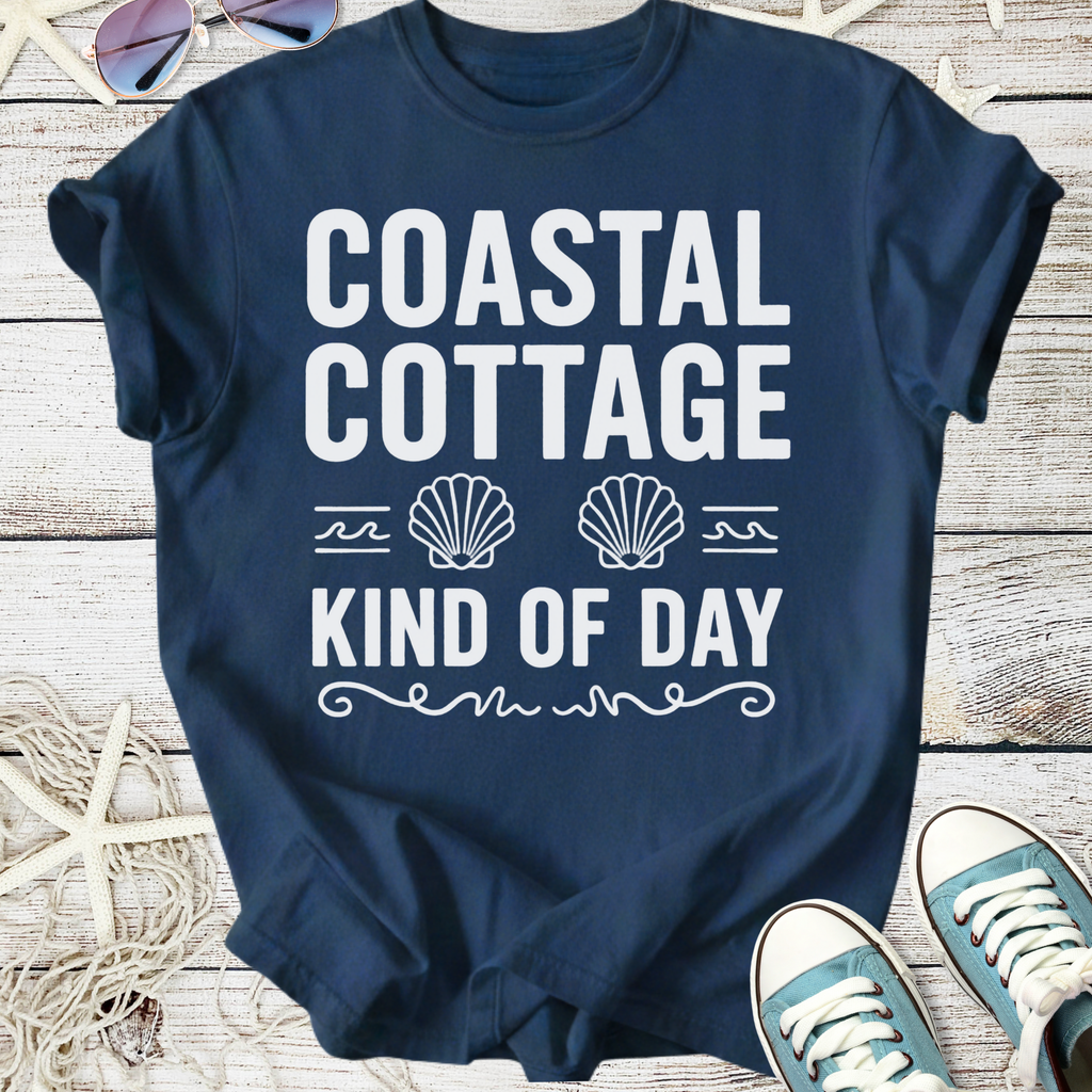 Navy blue t-shirt featuring 'Coastal Cottage Kind of Day' graphic with seashell design, perfect for beach lovers.