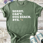 Green unisex t-shirt with funny dog-themed text and paw print, perfect for beach lovers.